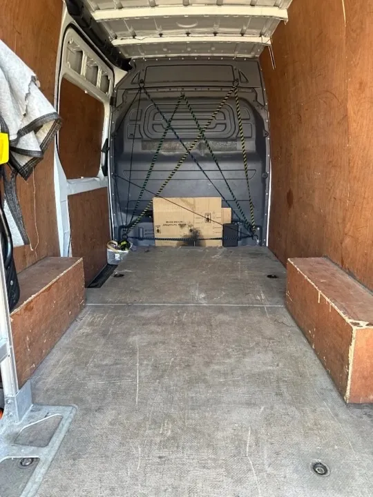 Equipped removals van interior Clean equipped removals van interior with plywood lining and tie-down points ready for UK relocations