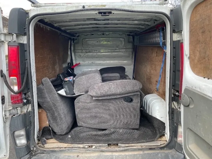 Furniture collection — grey recliner sofa Grey reclining sofa loaded inside a professional furniture collection van for delivery across the West Midlands