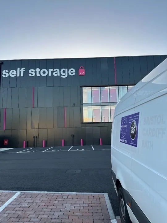Storage solutions — delivery van at self storage Delivery van parked at a modern self-storage facility with visible storage units for secure household storage solutions