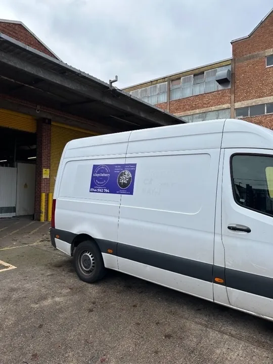 Storage solutions — van at warehouse loading bay Removal van parked at an industrial warehouse loading bay for storage collection and delivery across the West Midlands